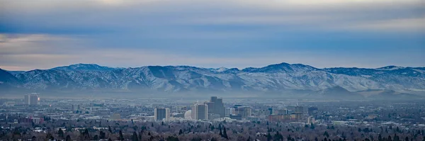 Panoramic view of Reno, Nevada skyline on overcast winter morning. — Stok fotoğraf
