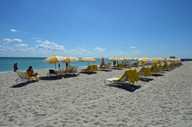 Umbrellas and people on Miami Beach, Florida at Lincoln Road.