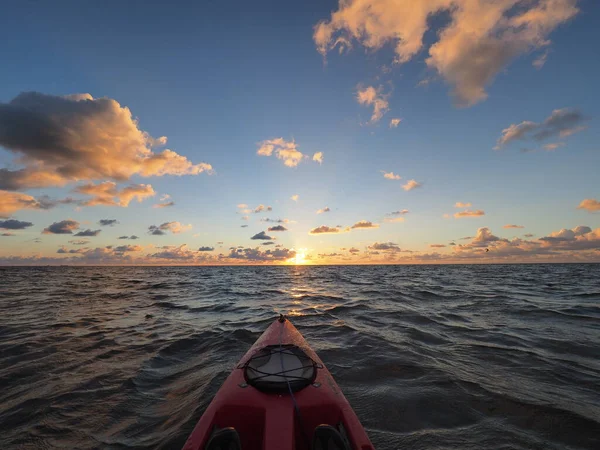 Red kayak at sunrise in Bear Cut off Key Biscayne, Florida. — Stock Photo, Image