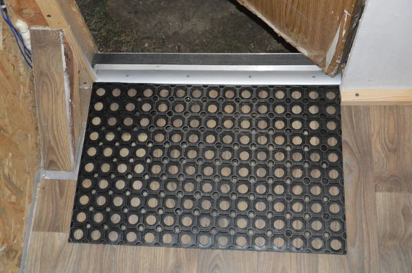 Installation of floor skirting boards on the floor and linoleum