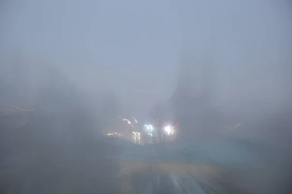 Autumn city in the fog in the morning at sunrise — ストック写真