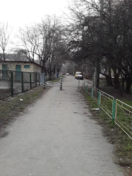 Metal fence posts on the road in the city — 스톡 사진