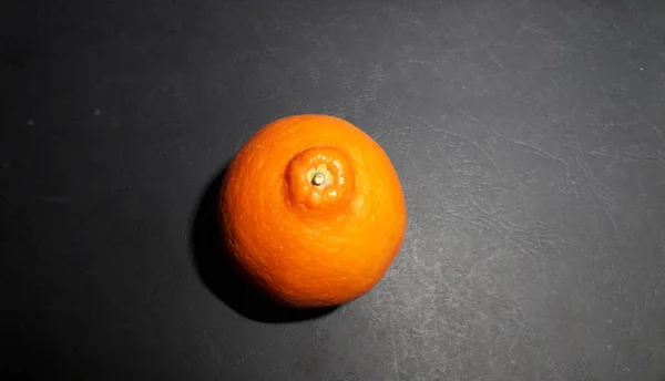 Orange mandarin on a black background — Stock Photo, Image