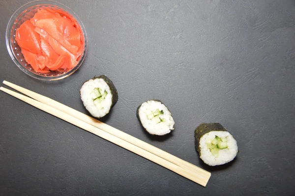 Different sushi sets from a japanese restaurant on the backgroun — Stock Photo, Image
