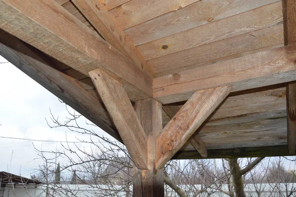 Construction of a gazebo made of wooden structures in  garden