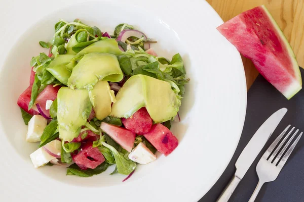 Valeriana sallad vattenmelon avokado Stockbild