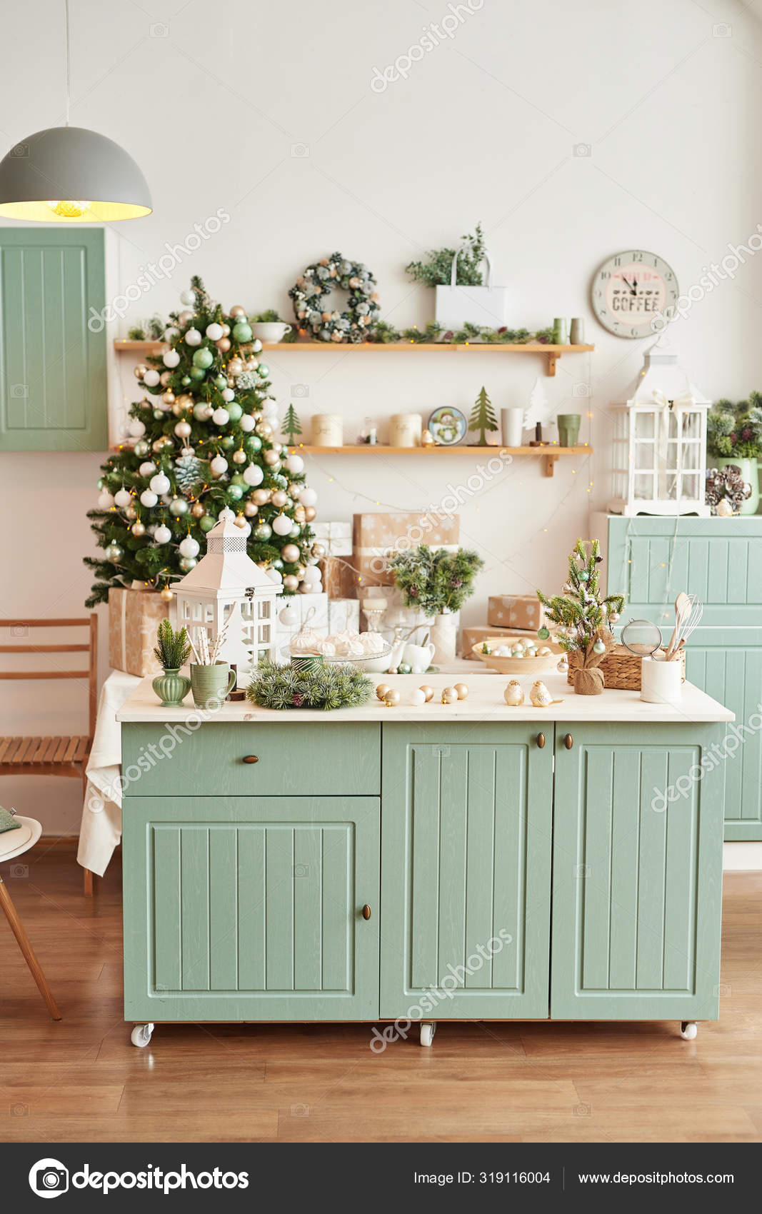 Interior light kitchen with christmas decor and tree. Turquoise-colored  kitchen in classic style. Christmas in the kitchen. Bright kitchen in mint  and white shades with Christmas. Stock Photo by ©yarovoy_aleksandr 319116004