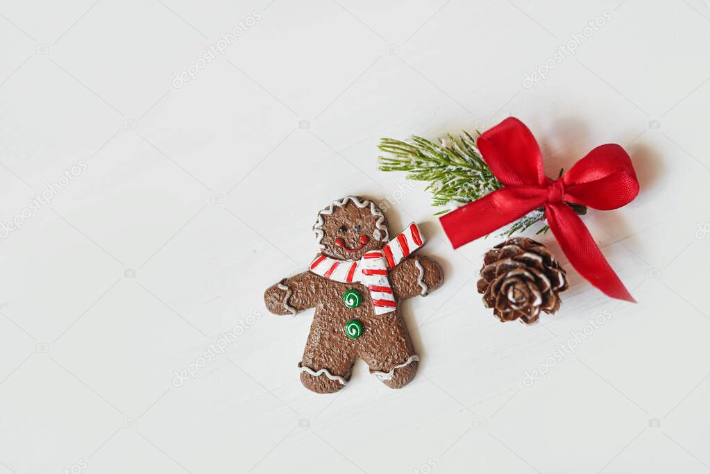Gingerbread. gifts and holiday, happy New Year. festive background. food background. top view. concept with Christmas gingerbread cookies, fir branches and cones.Festive concept with Christmas gingerb
