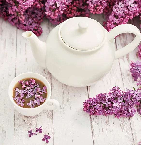 Good morning concept. Cozy morning. Tea set and lilac flowers. Happy birthday greeting card. Hello spring and summer. Greeting card for Women's Day and Mother's Day. Spring season, copy space.