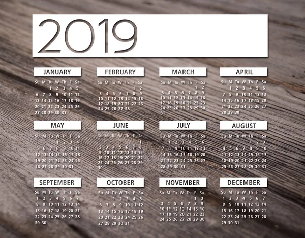 2019 calendario inglés fondo de madera — Foto de Stock