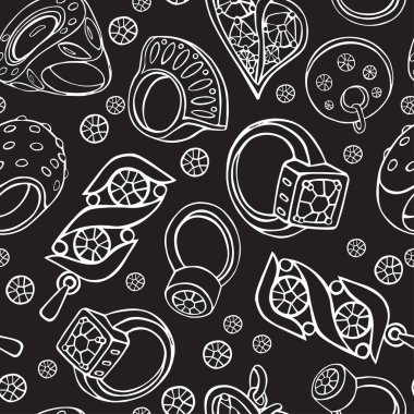 Siyah arka planda beyaz çizgili bir mücevher deseni.