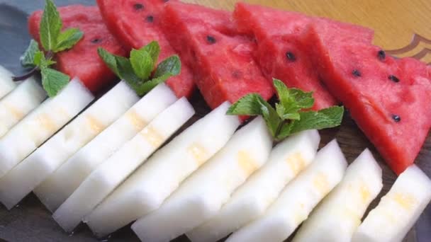 Fruits Black Plate Watermelon Melon Cut Slices Melon Watermelon Lying — Stock Video
