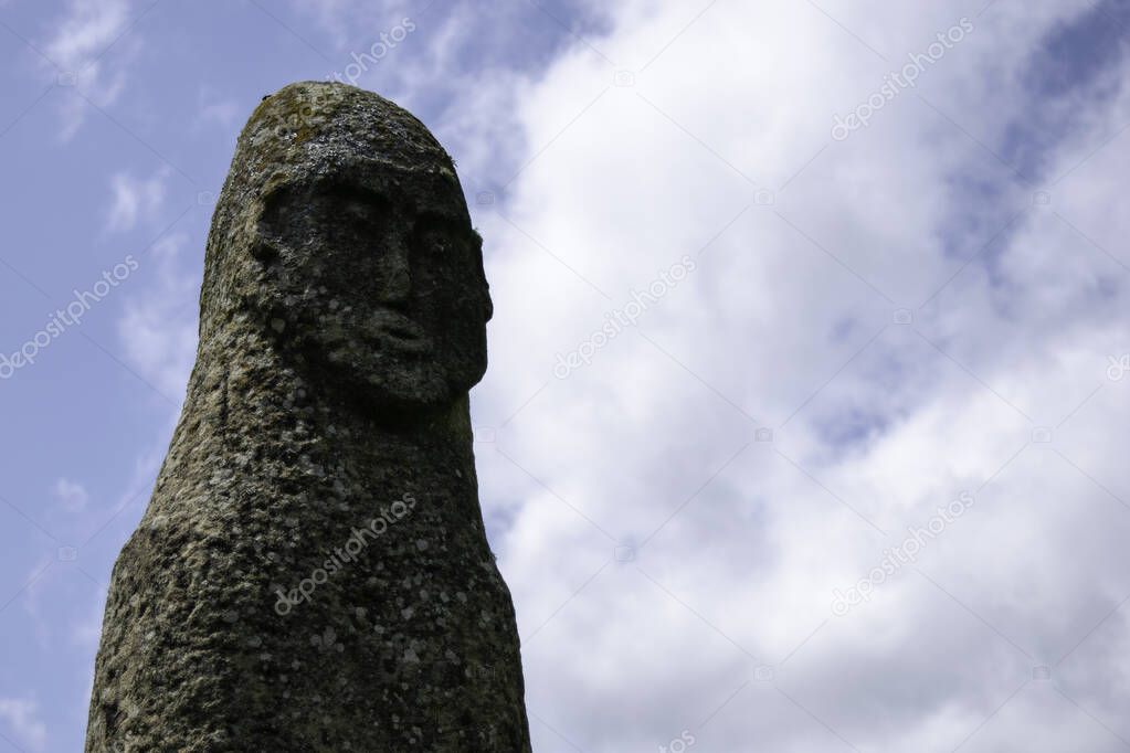 Face of the 8th century stone idol against a blue sky, Arkhyz, Karachay-Cherkessia, Russia
