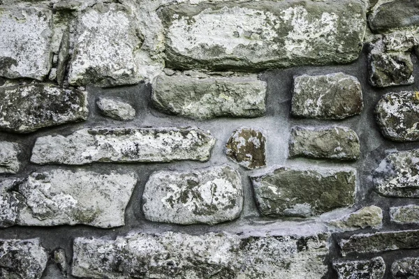 Textura de alvenaria, um fragmento de uma parede de pedra de um templo antigo do século X, fundo, pano de fundo — Fotografia de Stock