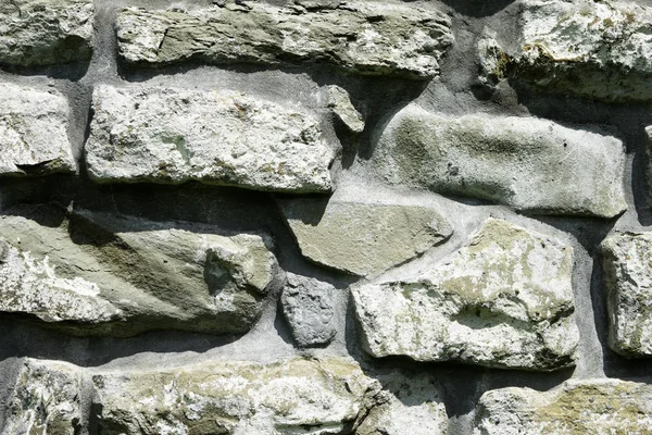 Textura de alvenaria, um fragmento de uma parede de pedra de um templo antigo do século X, fundo, pano de fundo — Fotografia de Stock