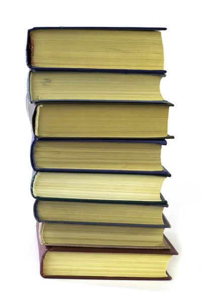 Stack med åtta böcker isolerade på den vita bakgrunden — Stockfoto