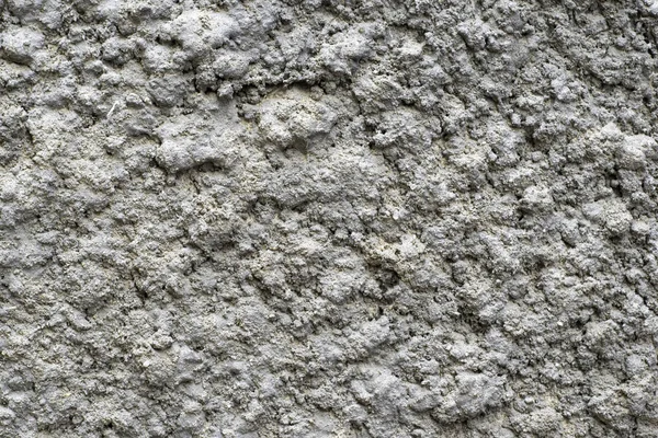 Каменная стена, оштукатуренная под шубой для текстурного фона — стоковое фото