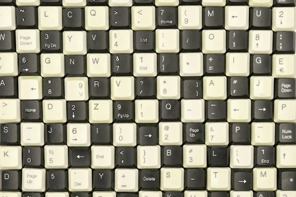 Conjunto de teclas de teclados antigos do computador dispostos sobre a mesa — Fotografia de Stock