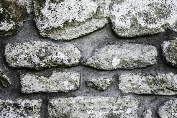 Textura de alvenaria, um fragmento de uma parede de pedra de um templo antigo do século X, fundo, pano de fundo — Fotografia de Stock