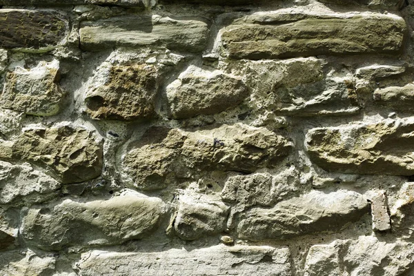 Struttura di muratura, un frammento di un muro di pietra di un tempio antico del X secolo, sfondo, sfondo — Foto Stock