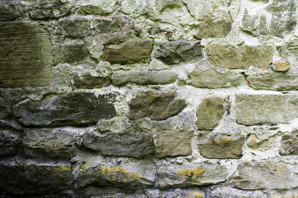 Textuur van metselwerk, een fragment van een stenen muur van een oude tempel uit de 10e eeuw, achtergrond, achtergrond — Stockfoto