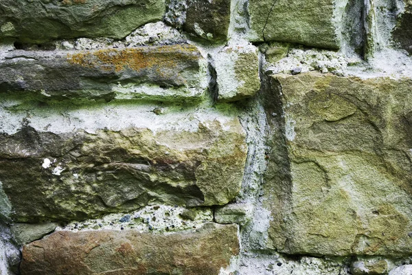 Textuur van metselwerk, een fragment van een stenen muur van een oude tempel uit de 10e eeuw, achtergrond, achtergrond — Stockfoto