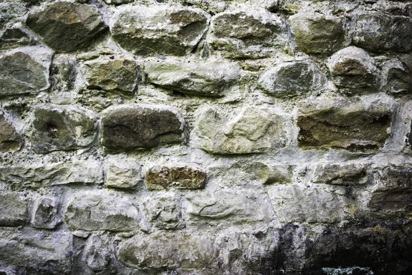 Textuur van metselwerk, een fragment van een stenen muur van een oude tempel uit de 10e eeuw, achtergrond, achtergrond — Stockfoto