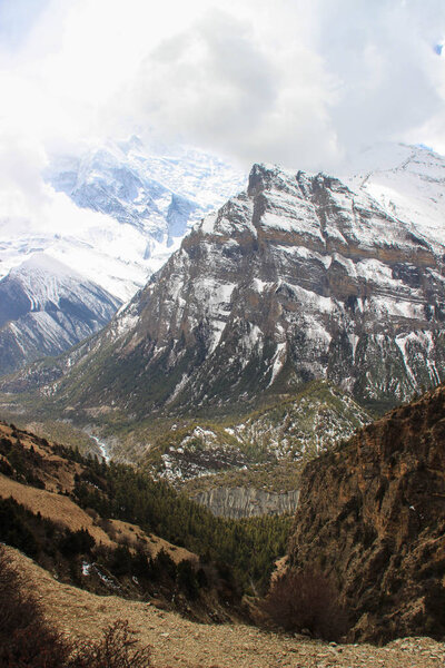 Beautiful nature views of the Himalayas mountains in Nepal. The highest pedestrian pass in the world Torong La on a trekking circle around Annapurna. Snowy mountains of the Himalayas.