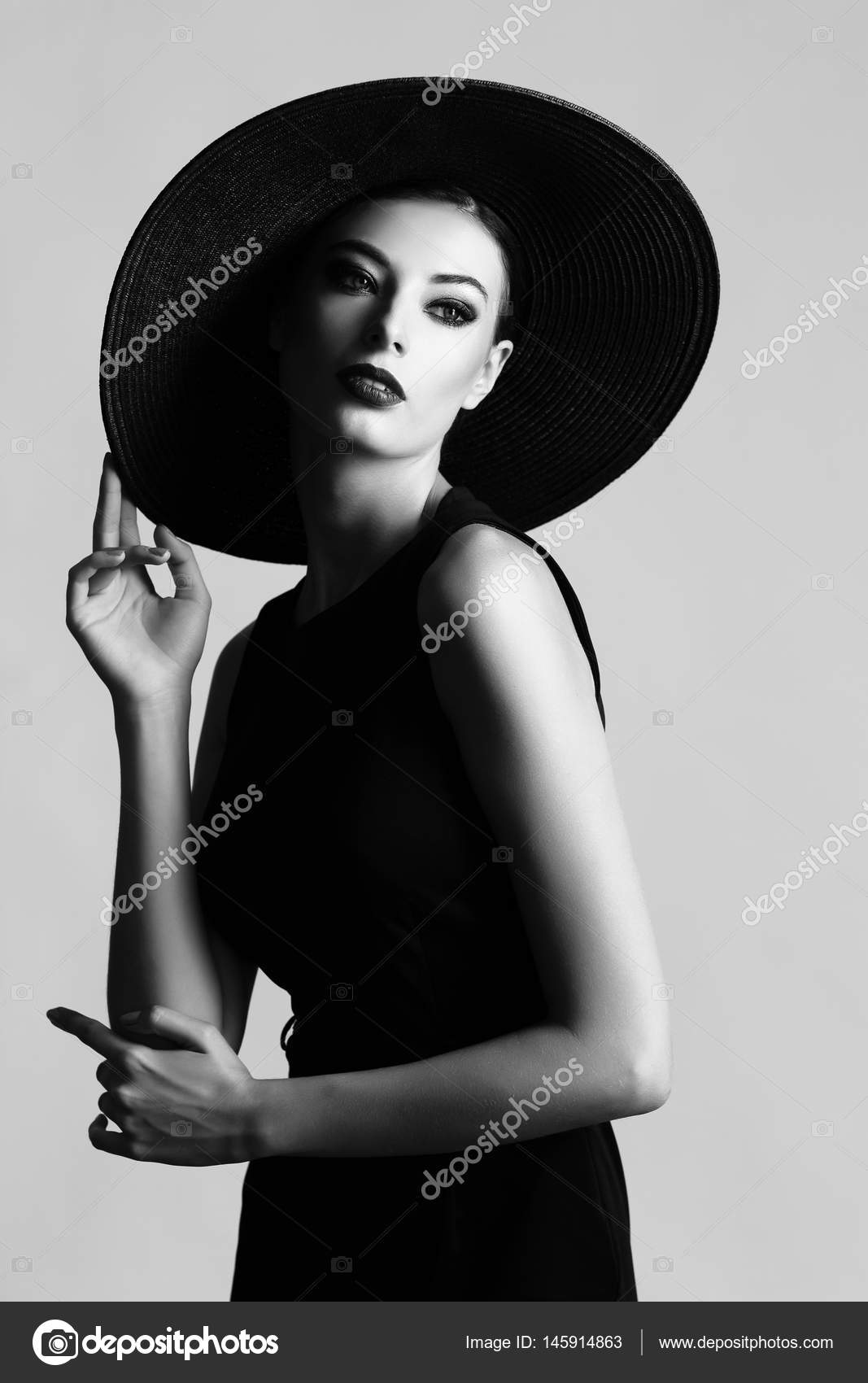 Femme chapeau noir images libres de droit, photos de Femme chapeau noir