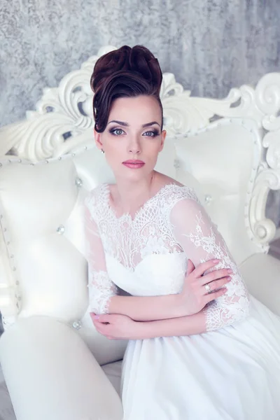 Young bride sitting in antique interior — Stock Photo, Image