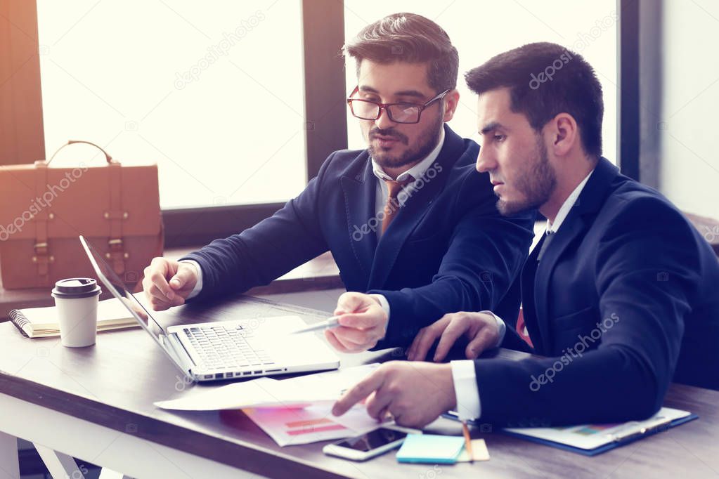 young businessmen working on laptop
