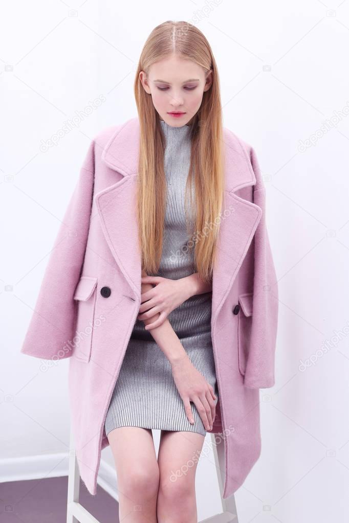 woman in trendy pink coat