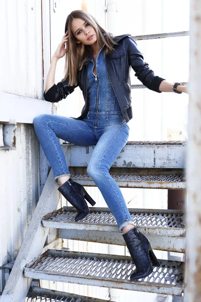 young woman wearing jeans overall