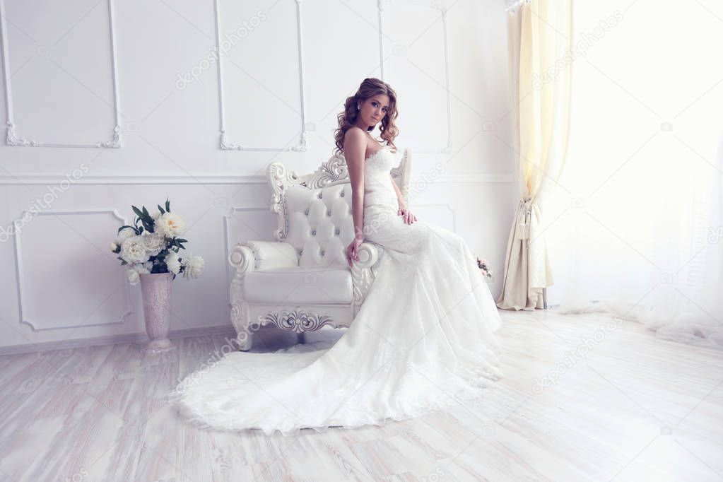 Young bride in antique armchair