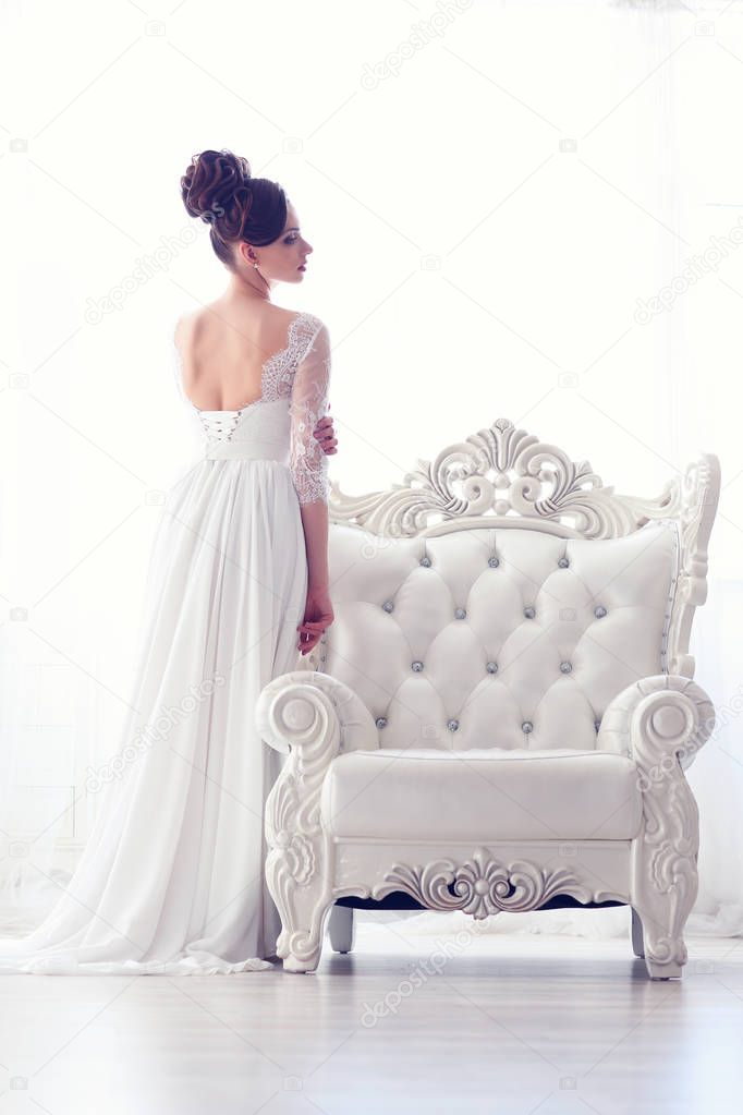 bride near antique armchair