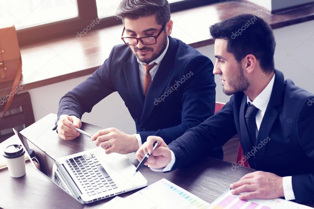 young businessmen working on laptop