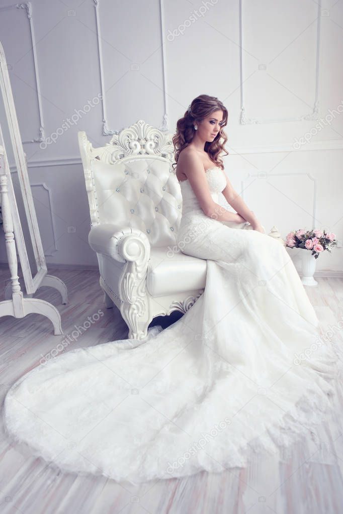 beautiful bride in antique armchair