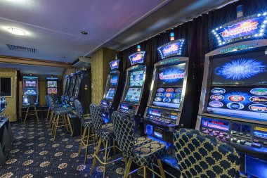 LAS VEGAS, USA - MAY, 2017: interior of elite luxury vip casino with rows of gambling slots machine in classic blue style color