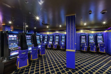 LAS VEGAS, USA - MAY, 2017: interior of elite luxury vip casino with rows of gambling slots machine in classic blue style color