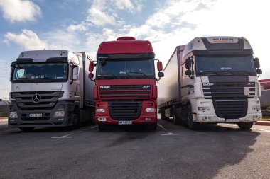 MINSK, BELARUS -  MARCH 2020: Trucks in a row with containers in the parking lot. Logistic and Transport concept