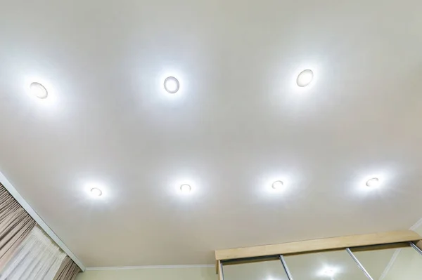 Suspended Ceiling With Halogen Spots Lamps And Drywall Construction In Empty Room In Apartment Or House Stretch Ceiling White And Complex Shape Stock Images Page Everypixel