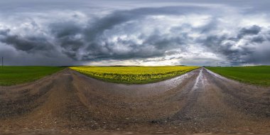 Full spherical seamless hdri panorama 360 degrees angle view on wet no traffic asphalt road near rapeseed canola fields with black sky after storm in equirectangular projection, VR AR content clipart