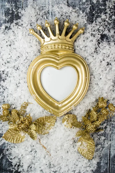 Christmas gold crown frame on gray wooden background — Stock Photo, Image