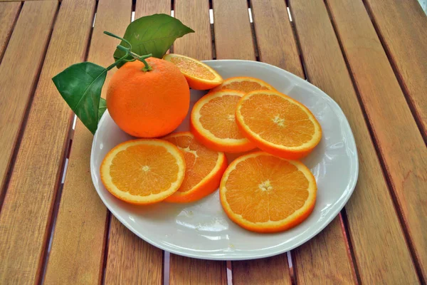 composition of oranges cut into slices ready to eat