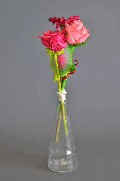 Cloth flowers inside a transparent glass jar — Stock Photo, Image