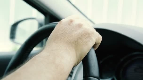 Hand on the steering wheel. Close-up — Stock Video