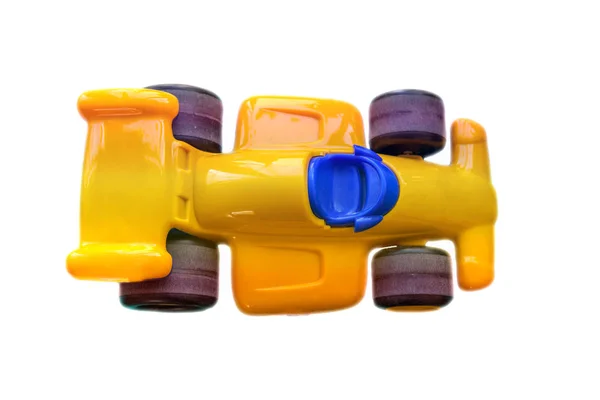 Child Car Plastic Yellow Big Old Wheels Top View Isolated — Stock Photo, Image