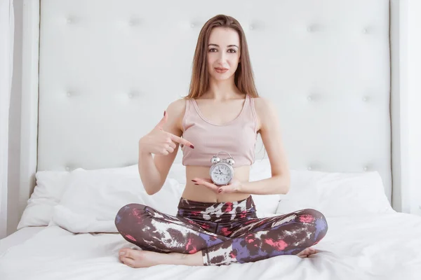 Beautiful Thin Woman Sits Lotus Position Holds Watch Ten Times — Stock Photo, Image