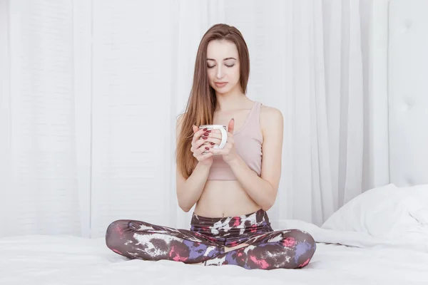 Beautiful Woman Sits Bed Lotus Pose Holding Mug Tea Easy — Stock Photo, Image