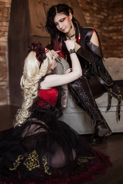 Gothic aristocrat, a vampire holds a woman's hand. Beautiful princess with a demon. Visual kei, aristocrat. Fairy tale, fantasy.